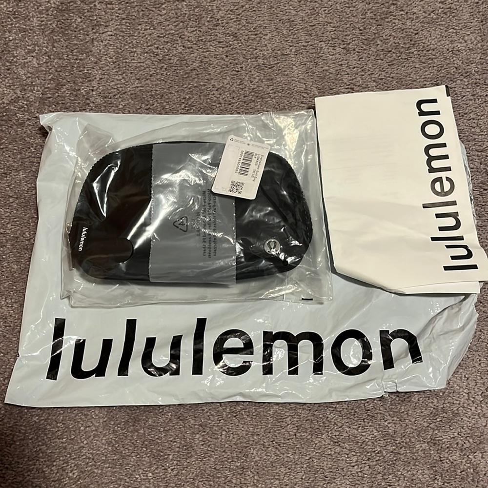 Lululemon wear everywhere cross body bag in black. NWT. NEVER OPENED
